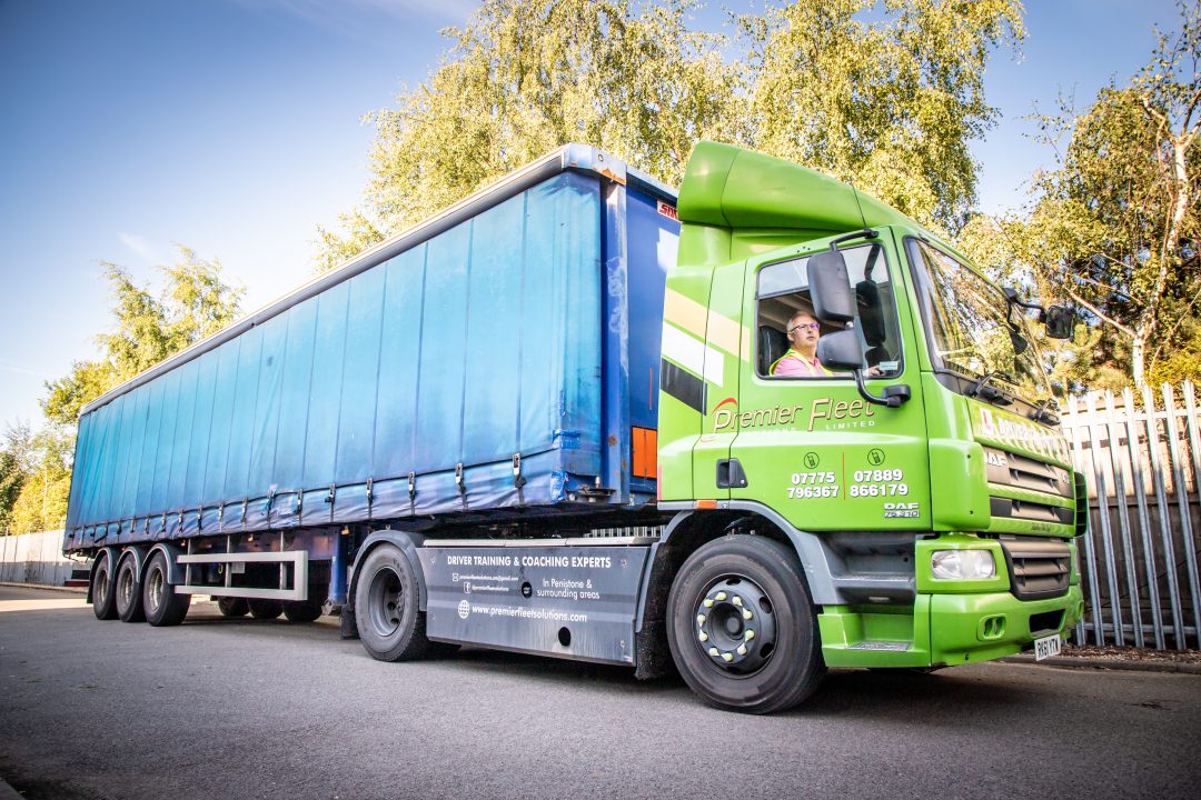 Man learning HGV Driver Training Category C+E in Premier Flee Solutions artic lorry